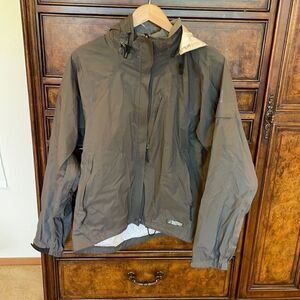 REI woman’s gray rain jacket.